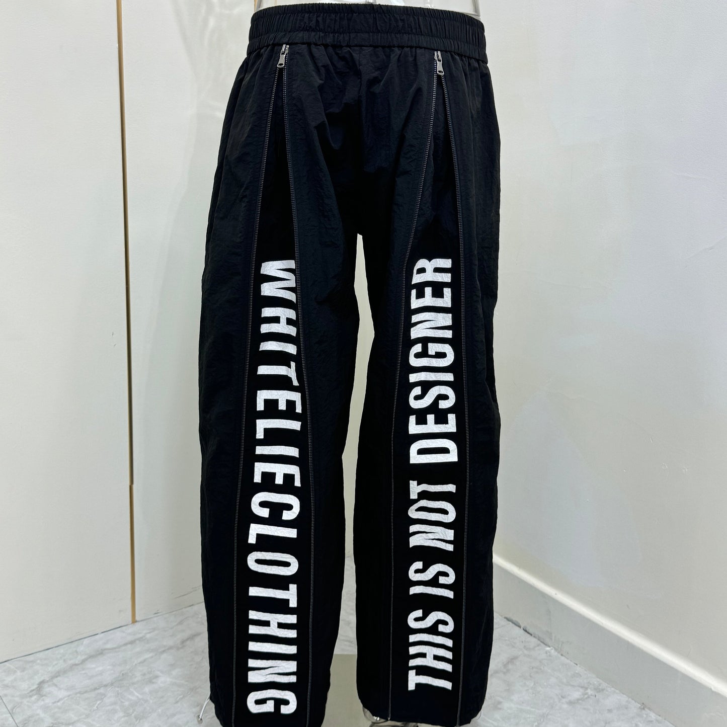 "This Is Not Designer" Layer-Zipped Nylon Pants